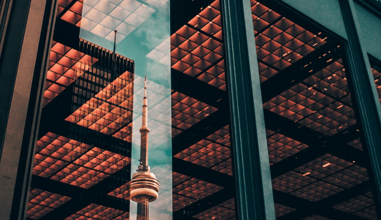 reflection of tower in office building window