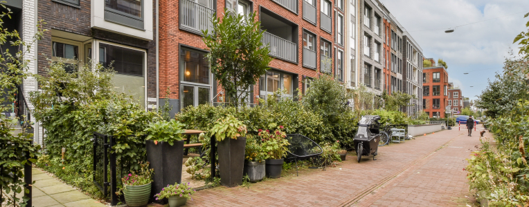 Contemporary residential buildings showcase sleek designs and harmonious layouts, surrounded by lush greenery and walkable paths, emphasizing urban living.