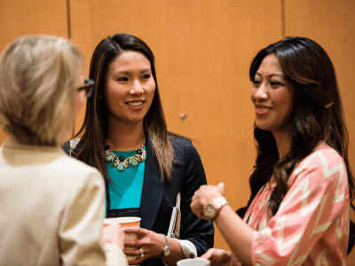 Three women talking at CREW networking event