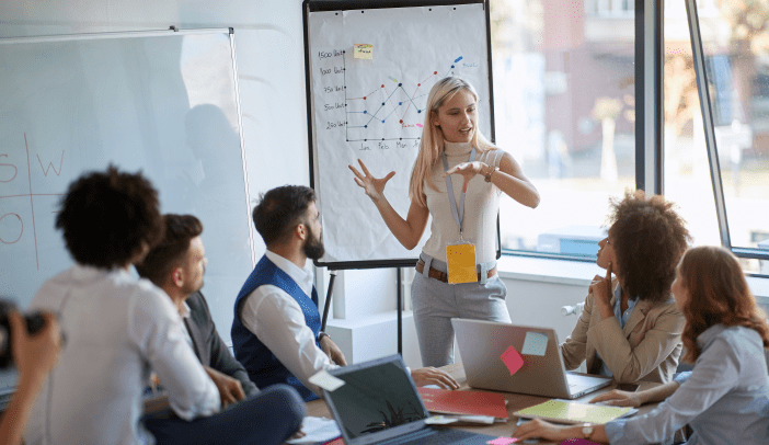 Business woman present  her idea to working team.Business colleagues talking about plan or new project.