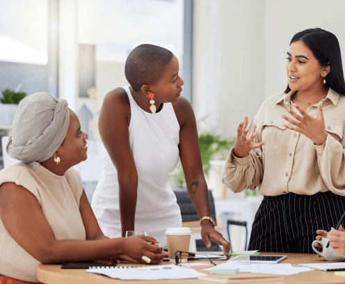 Diverse group, teamwork and young business women brainstorming, collaboration or cooperation. Ambitious confident professional team of colleagues talking and planning a marketing strategy together.